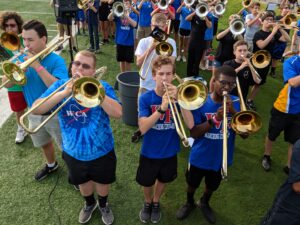 Photo of high school trombone players practicing together during band day.