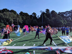 Photo of color guard practice during band day.
