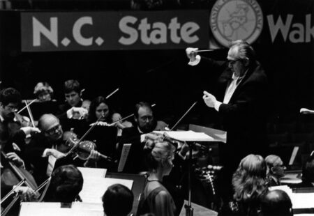 Black and white photo of the symphony performing a concert in the 80s.