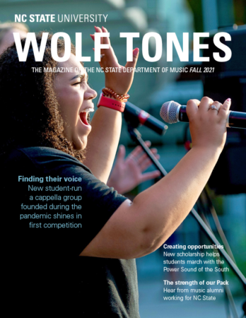 Picture of the cover of Wolf Tones magazine featuring a student singing into a microphone
