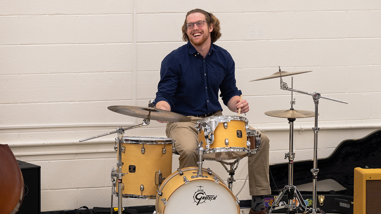 Coleman Williams performs on drum set during a recital.