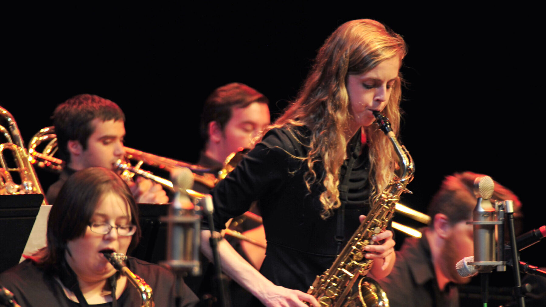 saxophone player performing in a jazz concert.