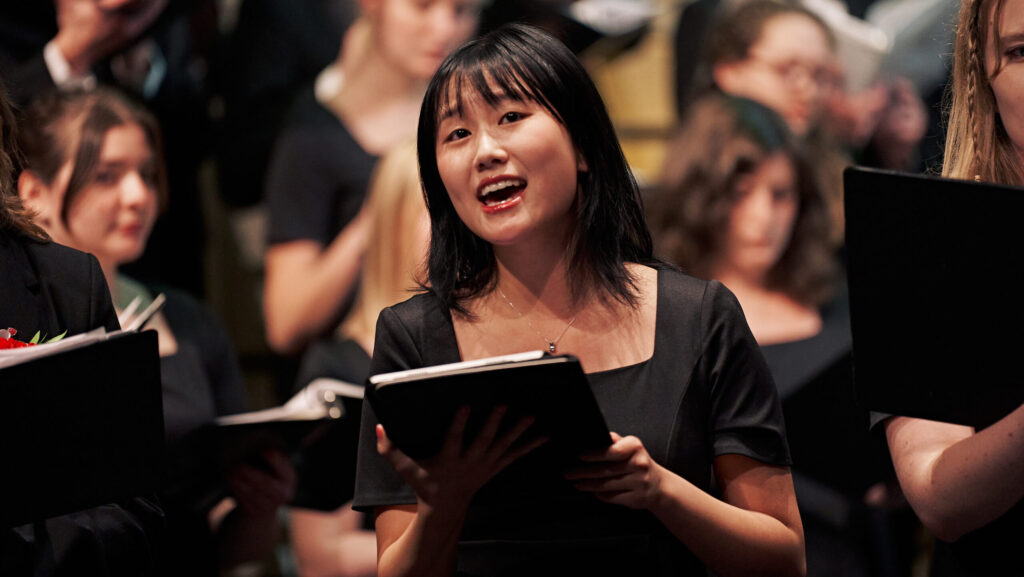 choir student performs in a concert.