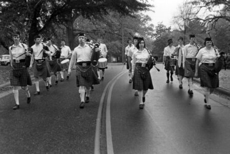 NC State pipes and drums band marching the street, circa 1970